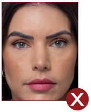 Image of unacceptable passport photo, incorrect framing, person is too close