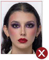 Image of unacceptable passport photo, person has too much make up on