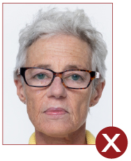 Image of unacceptable passport photo, person with glasses on