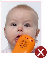 Image of unacceptable passport photo, baby with toy