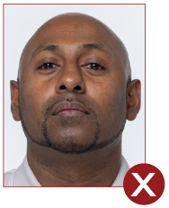 Image of unacceptable passport photo, persons head tilted