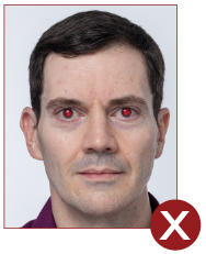 Image of unacceptable passport photo, red eye effect on image